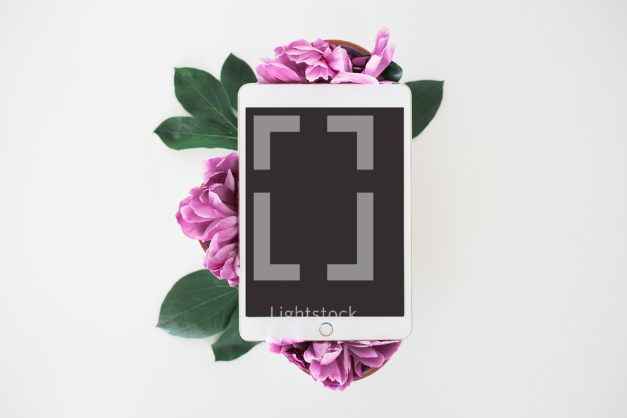 ipad on a cup of flowers 