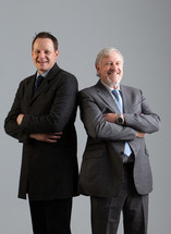businessmen standing next to each other in studio 