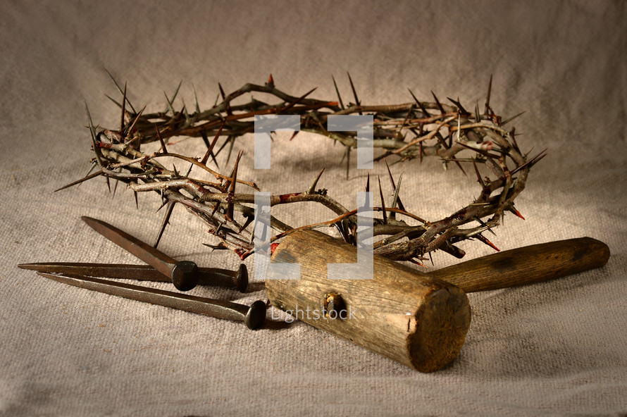 crown of thorns, mallet, and nails 