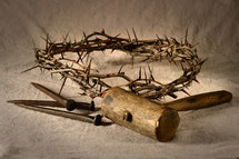 crown of thorns, mallet, and nails 