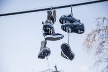 Frozen Shoes on a line are covered in ice from an ice storm