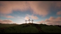 Three crosses on the green hill with clouds moving on blue starry sky and the sun rising. Easter, resurrection, new life, redemption concept.