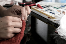 a seamstress sewing 