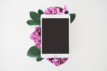ipad on a cup of flowers 