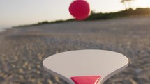 Ball bouncing on beach paddle