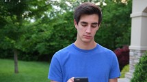 young man messaging on a phone 