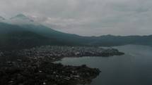 Aerial View Of The Santiago Townscape Beside The Crater Lake Of Atitlan In Guatemala.	