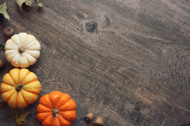 Autumn Thanksgiving Season Holiday Background with Pumpkins Over Wood