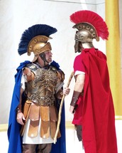 Two Roman Soldiers meet to discuss orders in a courtyard in old Jerusalem.