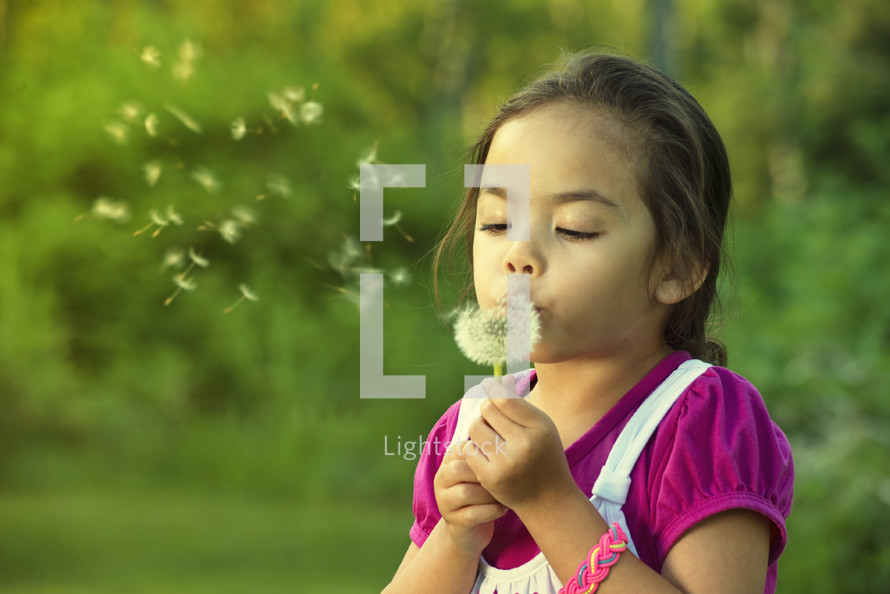 Girl Blowing Dandelion Seeds