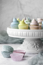 Colorful cupcakes on cake plate