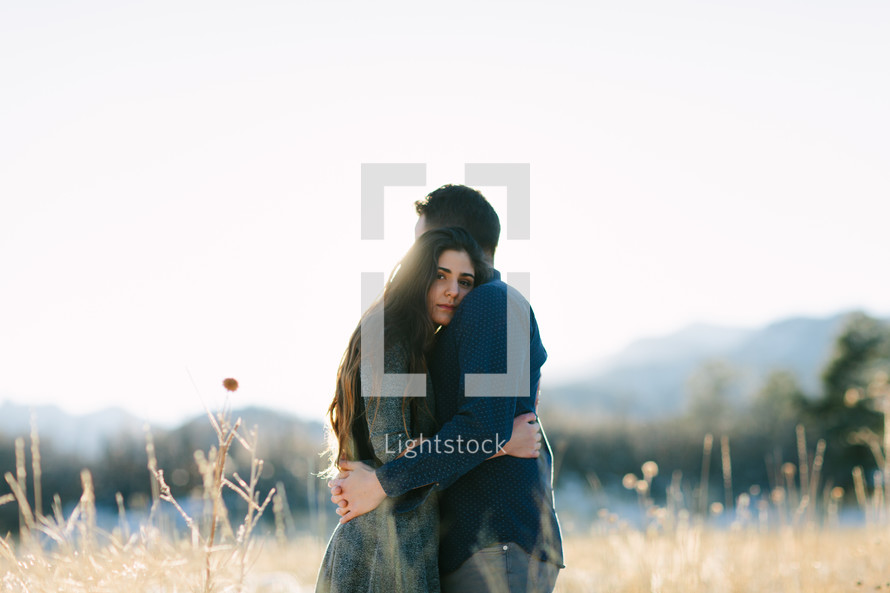 couple hugging outdoors  