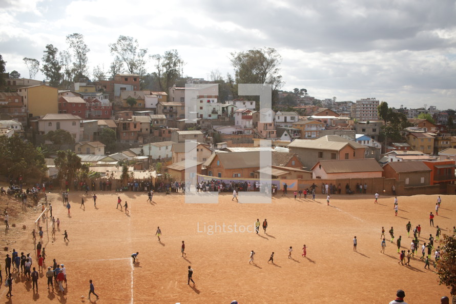 dirt sports field in a village 