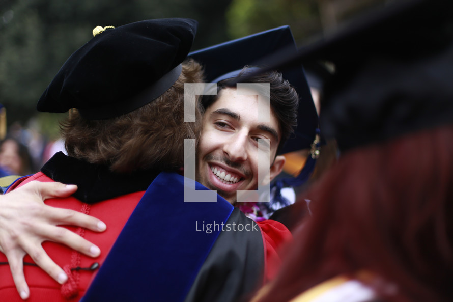 hugs at a graduation ceremony 