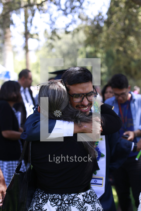 hugs after a graduation ceremony 