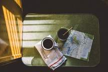 mug and map on a table in a camper 