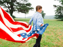 woman running with an American flag 