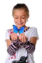 young girl holding a blue butterfly