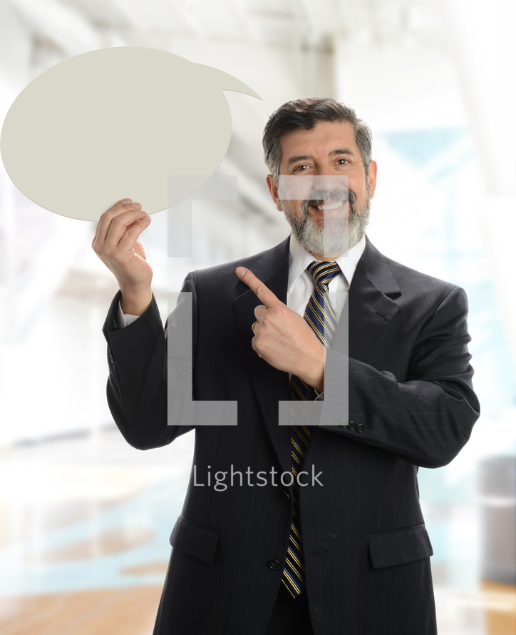 senior businessman holding a thought bubble 