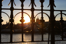 view of Prague through ornate wrought iron fencing 