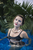 a woman in a swimming pool posing 