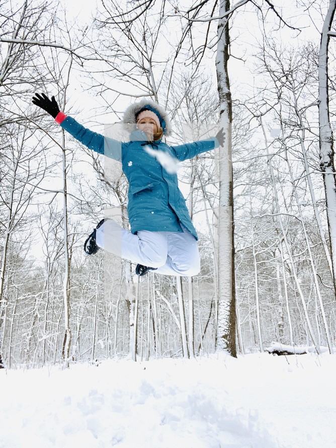 a woman celebrating in snow 