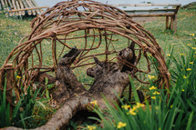 woven sticks art in a garden 