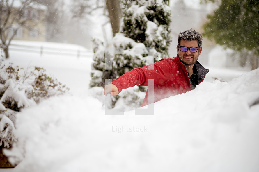 a man playing in snow 