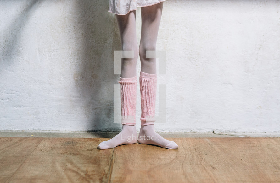 legs of a ballerina in dance class 
