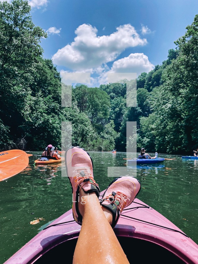 relaxing on a kayak on a lake in summer 