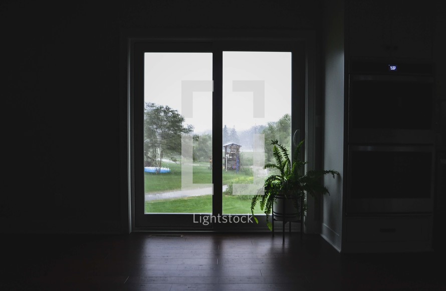 view of a backyard through a window 