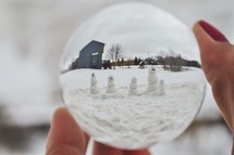 snowman family through a glass sphere 
