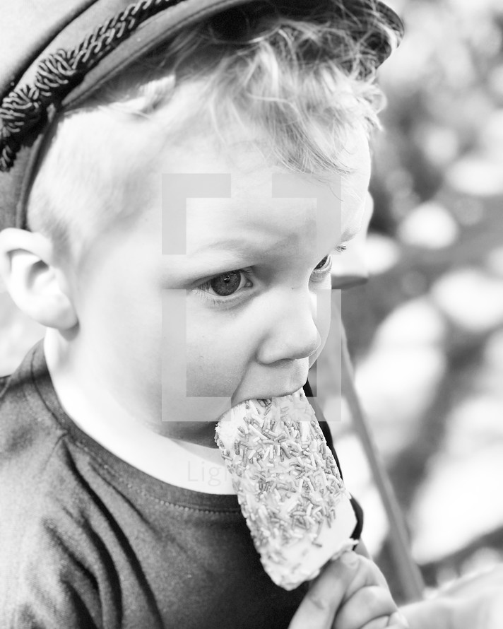 toddler eating ice cream on a stick 