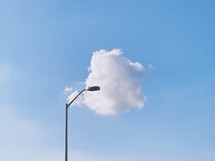 light post and puffy cloud 