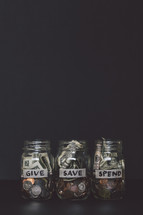 give, save, spend mason jars with money 