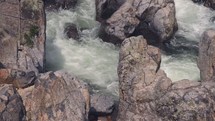 water flowing over rocks in a river 