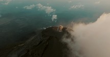 Active Fuego Volcano With Smoke Coming Out Of The Crater, Guatemala - drone shot	