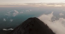 Fuego Volcano And Cloudy Sky In Guatemala - aerial drone shot	