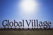 Global Village sign in the desert