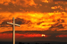 cross and a fiery sunset 