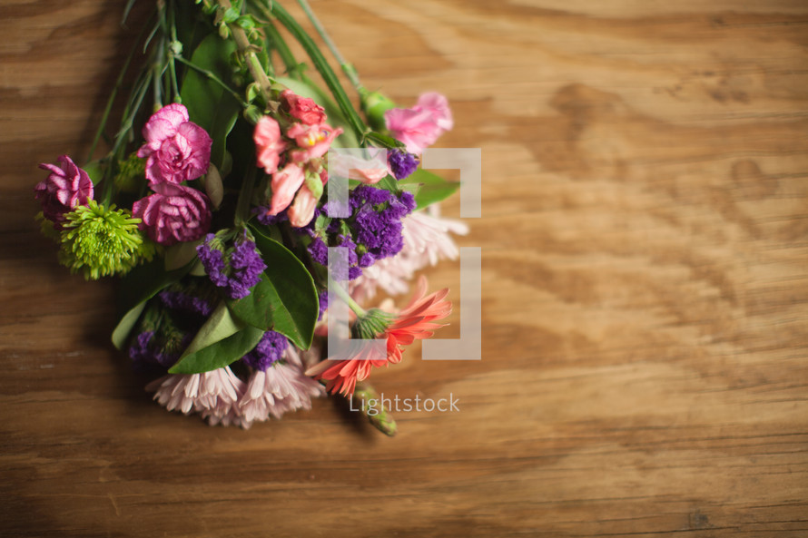Bouquet of flowers on wood.