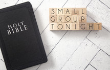 Bible on a white wood background - small group tonight 