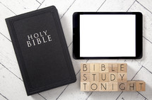 Bible and tablet on a white wood background - Bible study tonight 