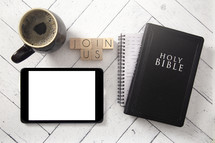 tablet, coffee cup, notebook, and Bible on a white wood background - join us