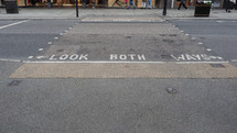 Look both ways sign at street crossing in London