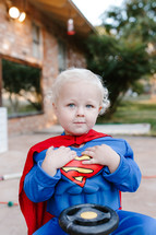 child in a superman costume