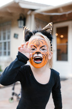 Girl with tiger face paint 