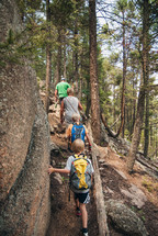 family hiking on a forest trail 
