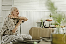 Elderly man sitting in chair