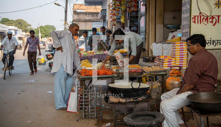 vendors selling food at a market in Mandawa, India 